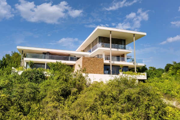JK House majestically dominates the hillside Sabadeco Terrace, offering over 13,000 sq. ft...